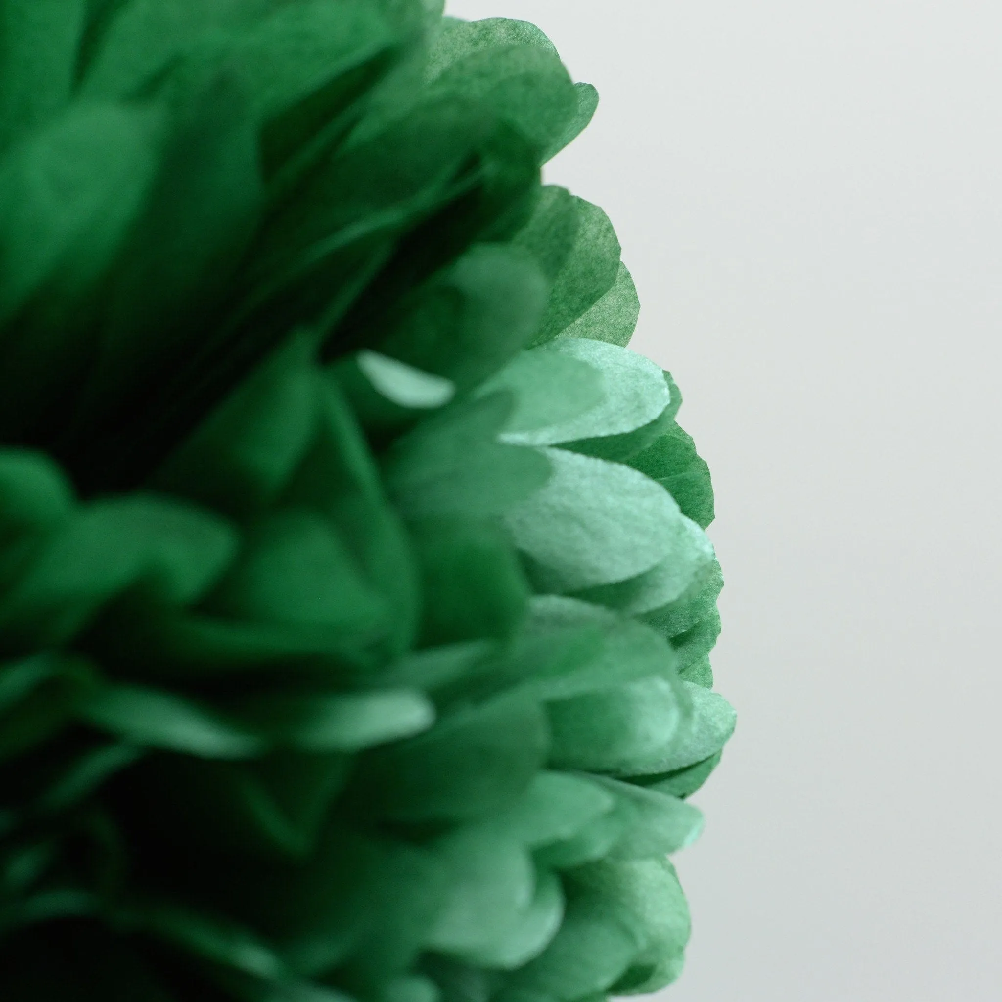 Shimmery Holiday green paper pom poms